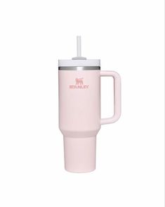 the pink travel mug has a straw in it