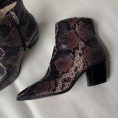 Gorgeous Snake Print Booties By Vince Camuto. Almost Brand New Condition. Never Worn Outside. Size 7.5 True To Size. Color Is A Burnt Brown With Brown Red Tone. Western Snip Toe Boots With Snake Print, Leather Snake Print Heeled Boots With Pointed Toe, Chic Snake Print Ankle Boots, Trendy Ankle-high Snake Print Boots, Red Tone, Brown Ankle-high Snake Print Boots, Vince Camuto Shoes, Snake Print, Vince Camuto