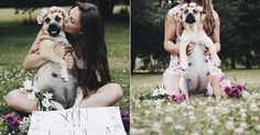 a woman sitting in the grass holding a dog and kissing her on the cheek with a sign that says soon i love you