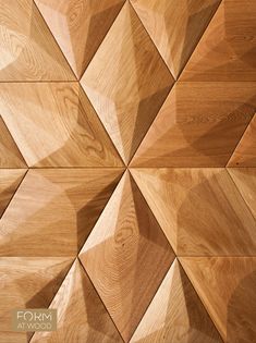 the wooden wall is made up of many different shapes and sizes, including wood planks