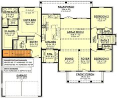 the first floor plan for a home with two master suites and an attached garage area