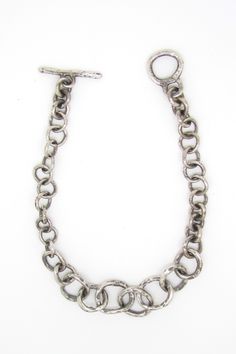 Silver Bracelet - The Round Chain Link Bracelet features a gradient of small to large hammered links, offering a lightweight feel and smooth touch. A thick toggle clasp ensures easy wear. Chain Link Bracelet Silver, Artful Home, Toggle Clasp, Chain Link Bracelet, Easy Wear, Silver Bracelets, Link Bracelets, Jewelry Ideas, Chain Bracelet