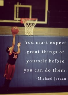 a man dunking a basketball into the hoop with a quote from michael jordan on it