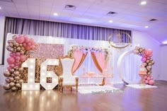 a decorated stage with balloons and decorations for a wedding reception at the grand hyate