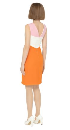 SALE! 1 LEFT! This gorgeous, sixties style dress is a perfect fit for springtime occasions. The fitted silhouette, sleeveless design, and structured pale pink shoulder panels lead to a white band and an orange body. The dress also features a feminine cutout with a dainty bow, and a v-neckline. Fully lined for comfort, this dress is sure to turn heads with its choice of flattering feminine details and easy to pair to colour scheme. Choose bespoke for alternate colour combinations or to alter hem Mod Spring Workwear Dresses, Fitted Pink Sleeveless Dress For Work, Fitted Mod Mini Dress For Spring, Mod Sleeveless Workwear Dresses, Spring Fitted Mod Mini Dress, Fitted Retro Sleeveless Knee-length Dress, Fitted Sleeveless Mod Dress, Spring Sleeveless Mod Dress, Spring Mod Fitted Dress