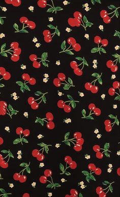 a black background with red cherries and white flowers on the bottom half of it