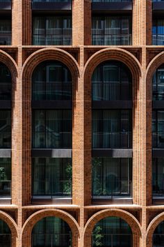 a large brick building with arches and windows