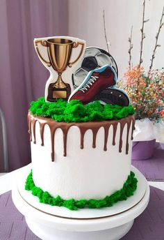 a cake decorated with green grass and icing