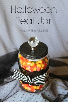 halloween treat jar with candy in it and the words, halloween treat jar on top