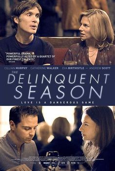 two people sitting at a table in front of a poster for the movie delinquent season