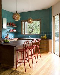 a kitchen filled with lots of counter top space next to a dining room table and chairs