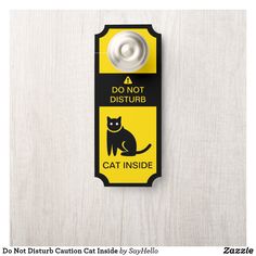 a do not disturb sign with a cat inside on the front and back of it