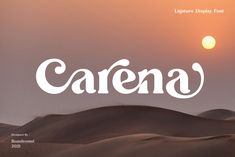 an image of the sun setting over sand dunes with the word carena written in white