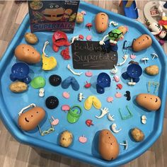 a blue tray filled with lots of toys