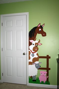 a horse and two lambs painted on the wall in a child's bedroom