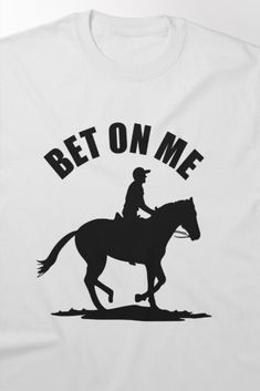 Bold horse riding t-shirt featuring the dynamic phrase 'Bet On Me' with a jockey on horseback, capturing the excitement of the race. Perfect for horse racing enthusiasts who want to showcase their passion and confidence in style. Horses, T Shirt