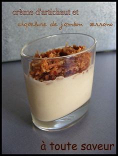 a small glass cup filled with granola and yogurt