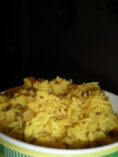 a bowl filled with rice sitting on top of a table