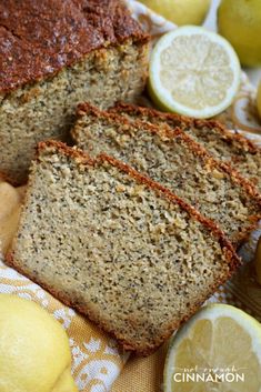 sliced loaf of banana bread with lemons on the side