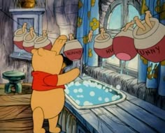 winnie the pooh is pouring water into a tub