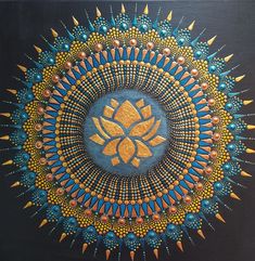 an artistic painting with gold and blue details on black background, depicting the sun surrounded by spikes