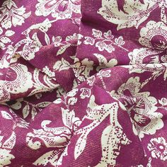 a purple and white floral print fabric