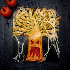 a piece of art made to look like a tree with branches and fruit on it