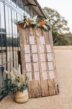 a wooden sign sitting next to a window