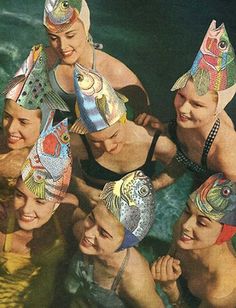 a group of people wearing hats in the water