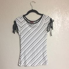 Size: Small. Brand: Knitenjin. New Without Tags, Never Worn. White Short Sleeve Top With Black Diagonal Stripes Of Varying Thickness. Also Features A Black Neckline And Black Sleeve Ends With Strings For Tying. Measures Approx. 12in Wide At The Waist Laid Flat, And 21.5in Long From Top Of Shoulder To Bottom Hem. 92% Polyester, 8% Spandex. Made In The Usa. Hand Wash Cold Water. Fitted White Knit Blouse, White Knit Blouse With Crew Neck, White Casual Knit Blouse, Casual White Knit Blouse, White Short Sleeve Tops, Diagonal Stripes, White Short, Striped Blouse, Short Sleeve Top