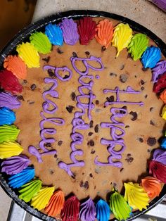 a birthday cake decorated with colorful icing and decorations