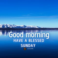 the words good morning have a blessing sunday on a lake with mountains in the background