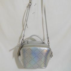 Street Level Silver Metallic Crossbody....Pmm 107 Small Crossbody...Has Top Handle......Has Zipper Closure And Back Outer Slip Pocket.....Interior Is Fabric Lined In Black And Has Two Slip Pockets Has Adjustable/Detachable Strap.....Approx 21" Approx 9-1/2" X H 6-1/2" X D 4-3/8" New With Tags....It Does Have A Few Scuffs On Top From Store Display As Shown In 4th Picture Women Street, Store Display, Small Crossbody, Top Handle, Black Silver, Metallic Silver, Bag Lady, Zipper, Tags