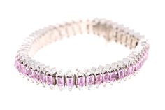 Pink Sapphire & Diamond Bracelet This Bracelet has 52 Natural Emerald Cut Pink Sapphires that weigh 12.00 Carats. It also has 104 Round Cut Diamonds that weigh 2.60 Carats. The total carat weight of the bracelet is 14.60 Carats. (Clarity: VS, Color: F) It is made in 14 Karat White Gold and weighs approximately 49.1 grams. The Bracelet is 7 inches long. Big Bracelets, Modern Bracelets, Multi Sapphire, Bracelets Gold Diamond, White Gold Bracelet, Tennis Bracelet Diamond, Natural Sapphire, Princess Cut Diamonds, Pink Diamond