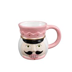 a pink and white coffee mug with a mustache on it's head, in the shape of a man