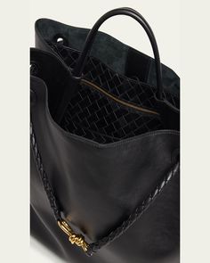 Bottega Veneta "Andiamo" tote bag in silky calf leather     Top handle     Sliding shoulder strap with knot hardware accent     Can be worn as a top handle or shoulder bag     Open top     Interior, one zip pocket and one card slot     Lining: Suede    Feet protect bottom of bag     Approx. 13.7"H x 16.5"W x 7"D    Made in Italy Designer Top Handle Hobo Bag For Daily Use, Designer Hobo Bag With Top Carry Handle For Shopping, Designer Hobo Bag With Double Handle For Daily Use, Luxury Bucket Tote Bag, Designer Top Handle Hobo Bag For Everyday, Designer Travel Shoulder Bag With Round Handle, Designer Bucket Bag With Detachable Strap For Everyday Use, Designer Hobo Bag With Leather Handles For Daily Use, Designer Bucket Bag With Top Carry Handle For Everyday