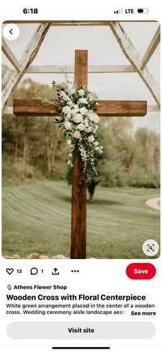 a wooden cross with flowers on it