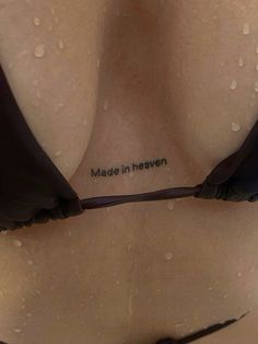 the back of a woman's bra with words written on it that read made in heaven