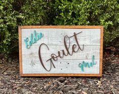 a wooden sign that says,'little crittet up'in brown and blue lettering