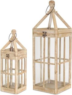 two wooden lanterns with glass panels on the sides and one has a key in it