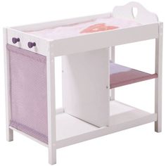 a white wooden baby crib with a pink blanket on it's top shelf