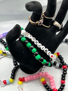 A cute bracelet with a one size fits most featuring the popular character from Kimetsu no Yaiba (Demon Slayer) Tanjiro. Take him on your travels wherever you may go. You never know when you need a Hashira. 🔥 Fandom Style Black Jewelry Gift, Black Fandom Jewelry Gift, Black Fandom Inspired Jewelry Gift, Customized Black Themed Jewelry, Customized Themed Black Jewelry, Adjustable Fandom Bracelets As Gift, Adjustable Beaded Bracelets For Fandom Gifts, Themed Black Wristband As Gift, Themed Black Wristband Gift