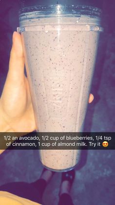 a person holding up a blender in front of their face with the words, 12 / 2 an avocado, 1 / 2 cup of blueberries, 14lb