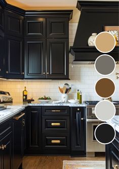 a kitchen with black cabinets and white counter tops