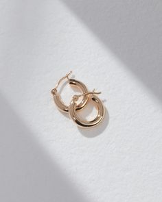 Add some gold to your ear party stack with our Amalfi Huggies, made from 100% 14K Gold and designed for everyday wear. The hollow tubing makes these earrings super lightweight, ensuring a comfortable fit all day long. 14k Gold Huggie Earrings With Shiny Finish As Gift, 14k Gold Filled Earrings With Polished Finish For Everyday, Small Hoop Earrings In 14k Gold With Shiny Finish, Small Hoop 14k Gold Earrings With Shiny Finish, Minimalist 14k Gold Huggie Earrings With Shiny Finish, Classic Small Hoop Earrings In Recycled Gold, Classic Hoop Earrings In Recycled Gold, 14k Gold Filled Earrings For Everyday, Everyday 14k Gold-filled Earrings With Polished Finish