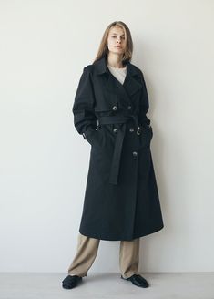 "A classic and timeless trench coat is a great addition to any wardrobe. It has ultimate versatility and pairs well with others. Our cotton black trench is a slightly oversized classic cut with a vintage touch to it. Perfect for the fall-spring season. ✈ free worldwide shipping ■ color: Black View shop for other color options: khaki, white, gray, light gray ■ material: Outer: 100% Cotton Lining: 100% Viscose ■ style: - relaxed fit - lined - double-breasted - classic length - belted - six-button Elegant Oversized Cotton Outerwear, Oversized Belted Cotton Outerwear, Oversize Trench Coat, Coat For Fall, Black View, Oversized Trench Coat, Black Trench Coat, Coat For Women, Trench Coat Black