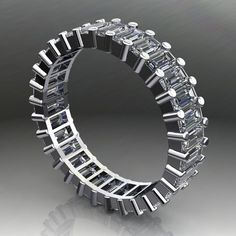 a ring made out of many different pieces of silver and white diamonds on a gray background