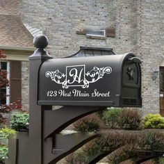 a mailbox in front of a brick house