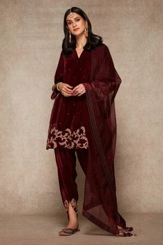 Maroon velvet suit, design pakistani dress, velvet dhoti pant, dhoti salwar,India diwali dress,plus size Pakistani salwar suit set, kurti dupatta set.  This beautiful velvet kurta has gold embroidery over the hem line and sleeves, paired with matching dhoti salwar with orgenza dupatta.  ✨This dress can be customise in any other colour and in all size, please contact us regarding any changes if you want.We will make this dress as per your choice.  ✨We use high quality fabric and threads for embroidery.You won't face any problem in future regarding fading of colour or anything. You can use this outfit for many years.  ✨There may be slight colour difference due to high quality camera resolution and other filters. Rest every thing will be same.  🌸All the dress are Dry cleane only Luxury Nida Salwar Kameez For Diwali, Luxury Bohemian Salwar Kameez For Diwali, Luxury Women's Naqshi Anarkali Set, Luxury Festive Salwar Kameez In Dola Silk, Luxury Salwar Kameez With Tassels For Diwali, Luxury Festive Unstitched Jamawar Suit, Luxury Ceremonial Churidar For Diwali, Luxury Designer Churidar For Festive Season, Luxury Unstitched Suit For Diwali Puja