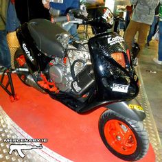 the motorcycle is on display at the convention